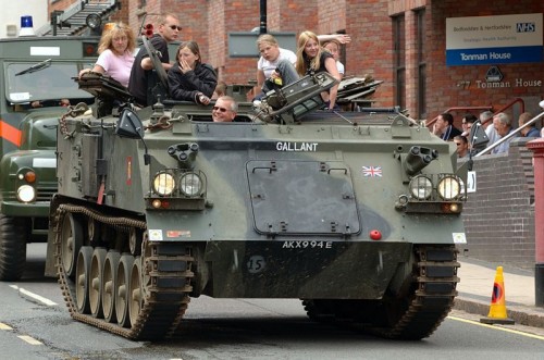 North London Barmy Army with FV 432 armoured personnel carrier, in carnival procession, St Albans, UK.