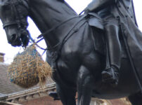 Traditional bale of straw added to a Whitehall Statue