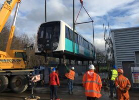 Replica DLR train arrives at Enfield college